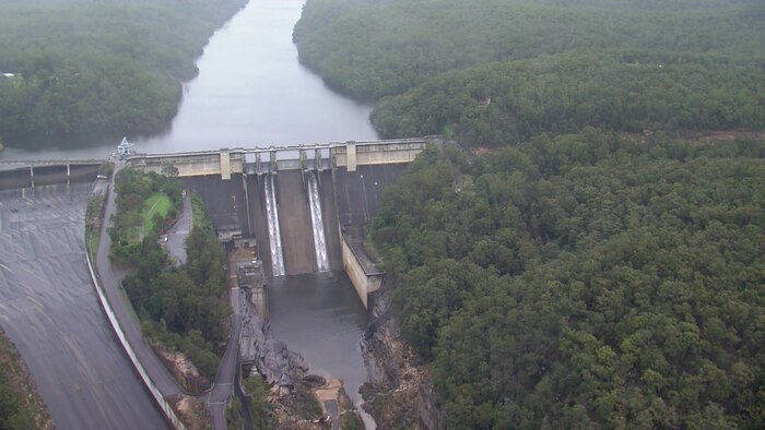 Bridge collapses, people rescued from floodwaters in New South Wales, Queensland