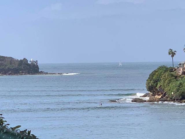 Image: Swell lines wrapping into the Sydney Harbour with the harbour heads in the background. Source: Felix Levesque