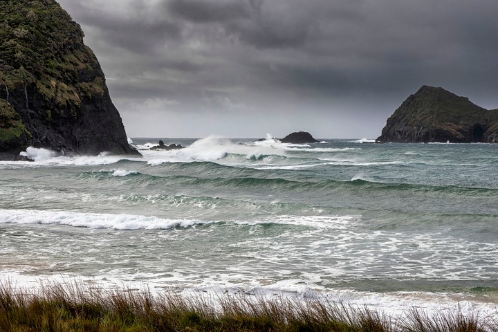 Image: Wind and waves batter Neds Beach, Lord Howe Island. Source: iStock / colbourne49