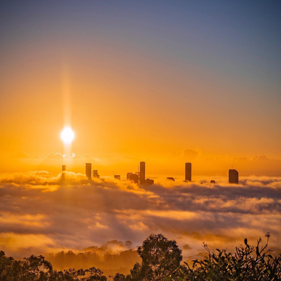 Fog swallows Brisbane, storms on the way 