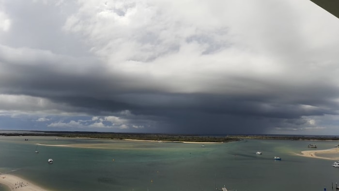 Tornado impacts Brisbane Airport in supercell storm event, more wild weather predicted for weekend from inland low pressure system