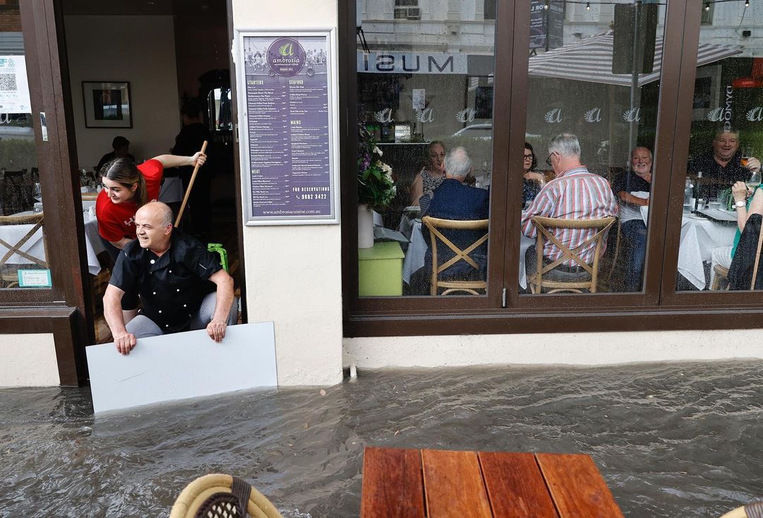 Melbourne diners not even slightly concerned by flash flood outside